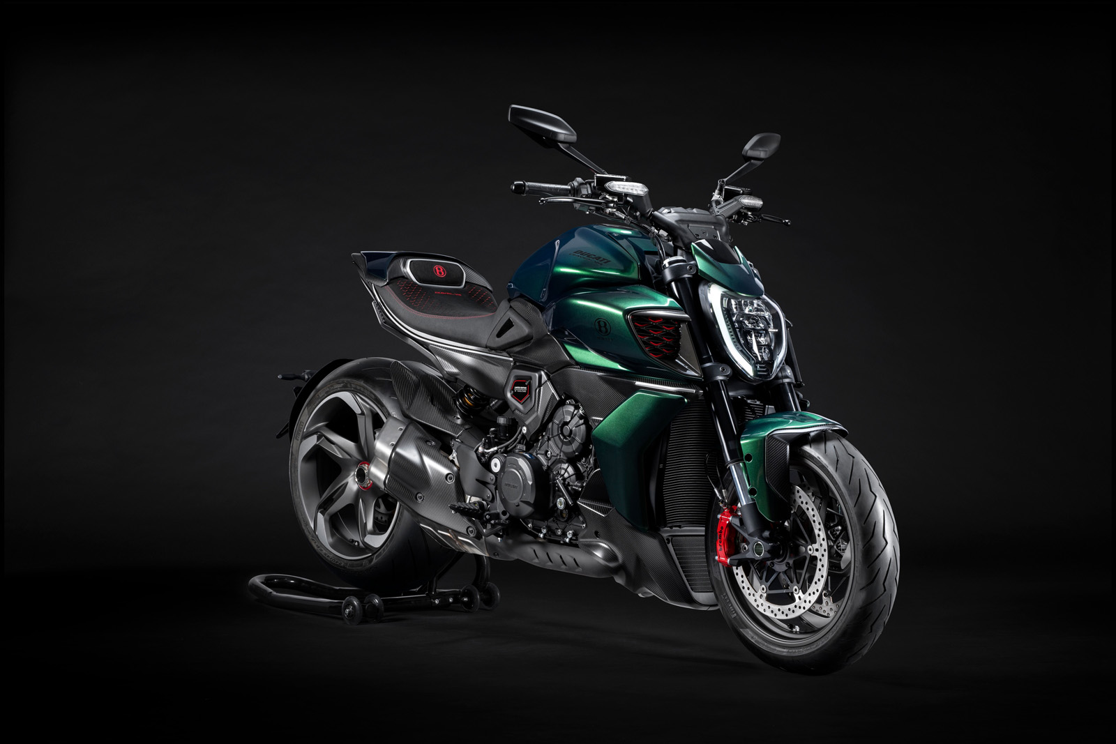 Ducati Diavel for Bentley in Scarab Green, front three-quarter studio shot showing the carbon fibre bodywork